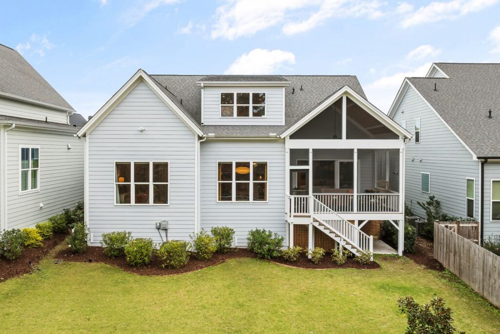 Illustrative stock photograph of a house exterior and shingle roof; not a property in the reported litigation.
