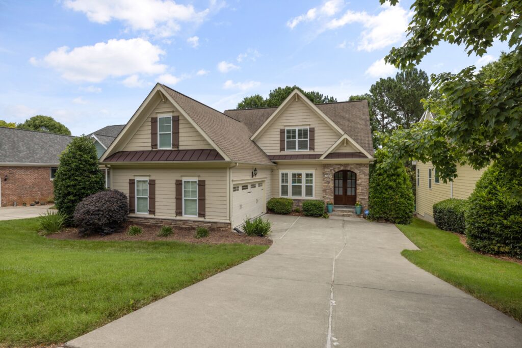 Illustrative suburban home with a shingle roof, lawn and driveway; not a property from the Oklahoma lawsuit.